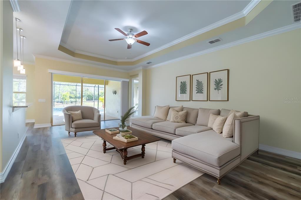 16122 Cedar Key Drive Wimauma, FL 33598 - Photo 34 of 98 a living room with furniture and a large window