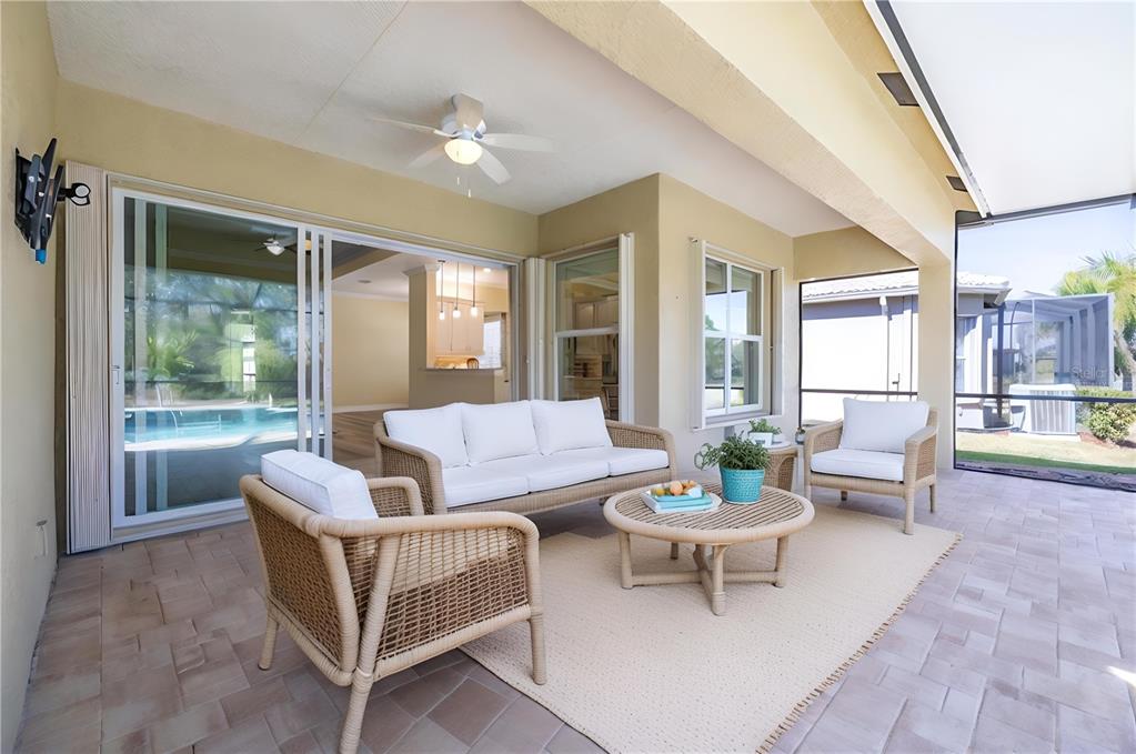 16122 Cedar Key Drive Wimauma, FL 33598 - Photo 36 of 98 a living room with furniture and a large window