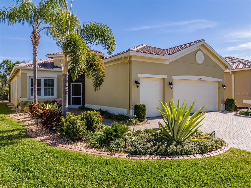 16122 Cedar Key Drive Wimauma, FL 33598 - Photo 4 of 98 a front view of a house with a yard