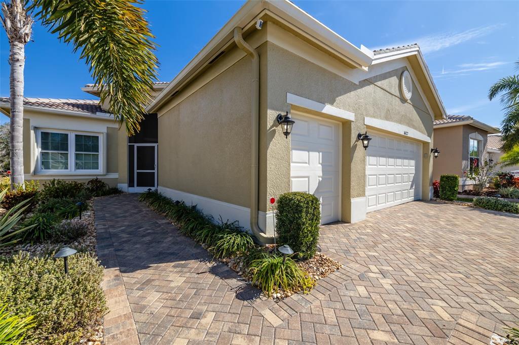 16122 Cedar Key Drive Wimauma, FL 33598 - Photo 5 of 98 a front view of a house with garden