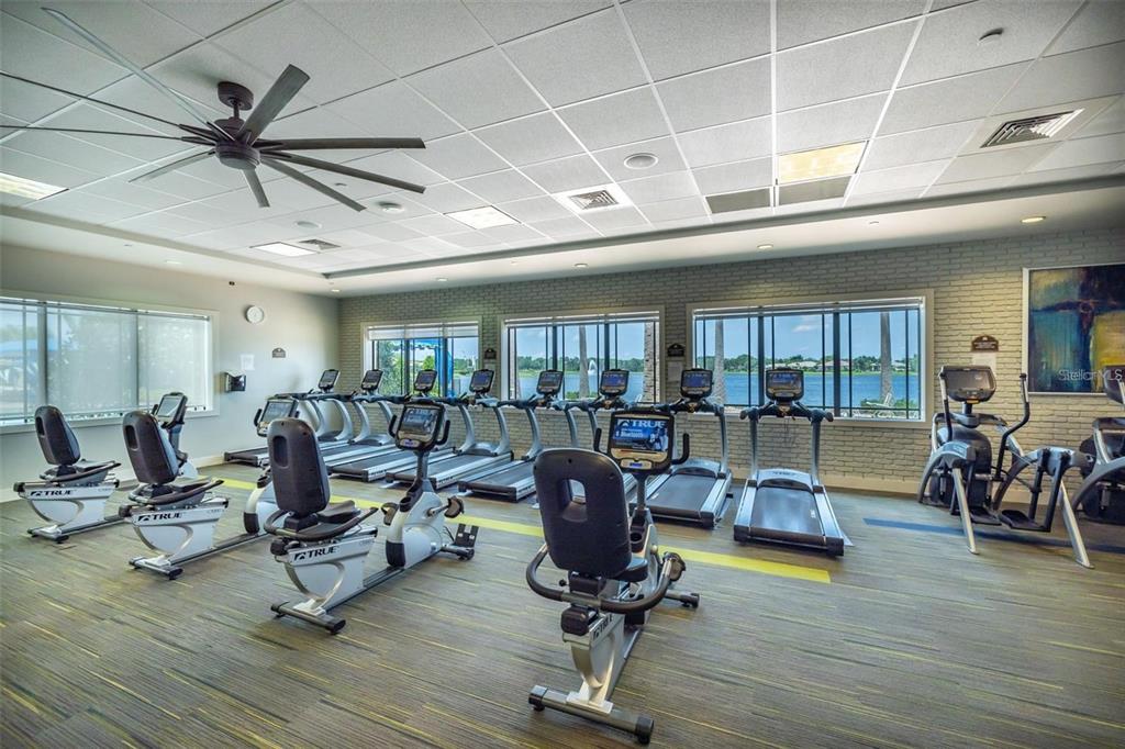 16122 Cedar Key Drive Wimauma, FL 33598 - Photo 73 of 98 a view of a livingroom with hardwood floor and a ceiling fan