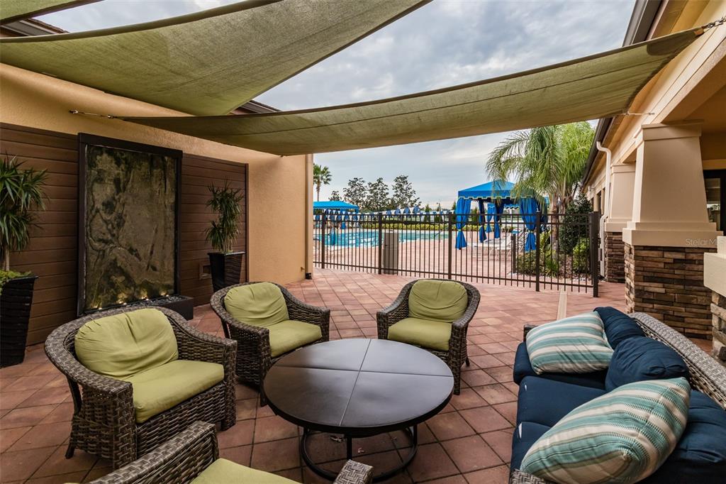 16122 Cedar Key Drive Wimauma, FL 33598 - Photo 79 of 98 a outdoor living space with furniture and a potted plant