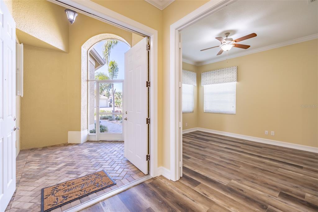 16122 Cedar Key Drive Wimauma, FL 33598 - Photo 8 of 98 a view of entryway with wooden floor