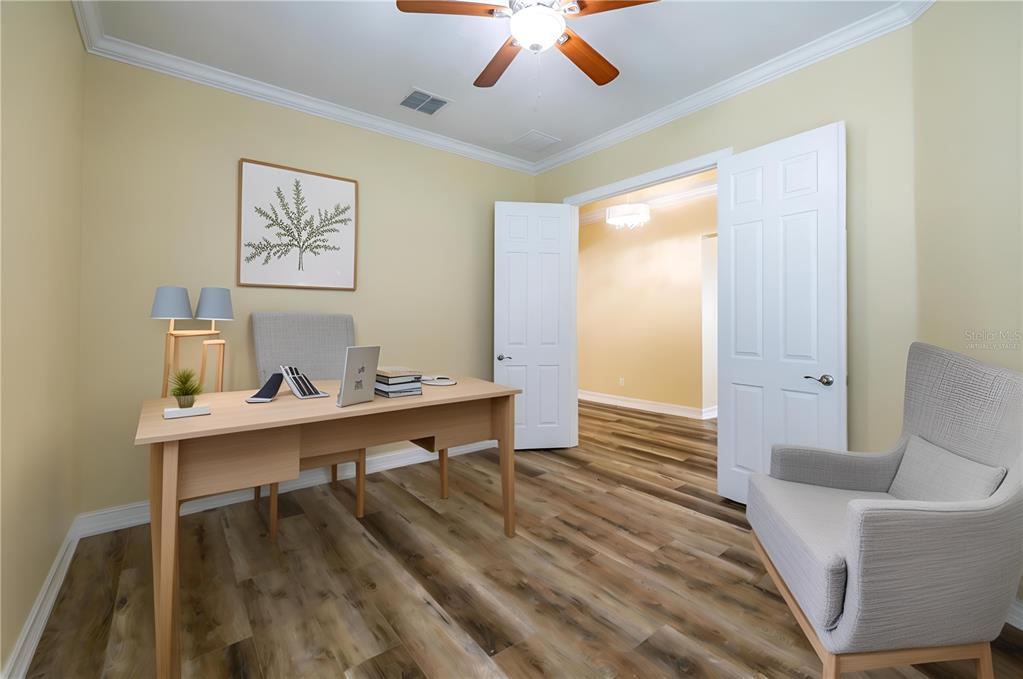 16122 Cedar Key Drive Wimauma, FL 33598 - Photo 10 of 98 a view of a workspace with furniture and wooden floor