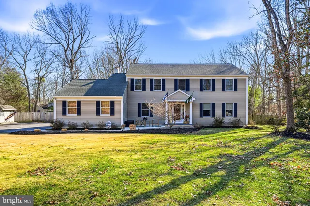 a view of a house with swimming pool in front of house