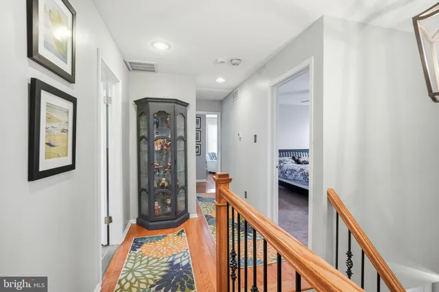 a bathroom with a tub sink toilet and mirror