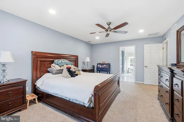 a large tub sitting in a bathroom next to a window