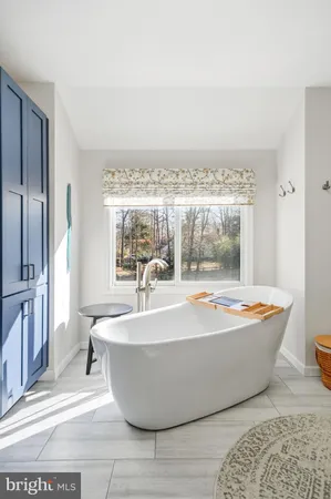 a view of walk in closet with clothes