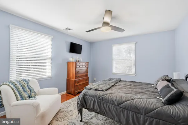 a room with gym equipment and a flat screen tv