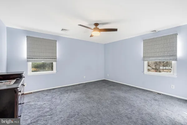 a storage room with furniture and a book shelf