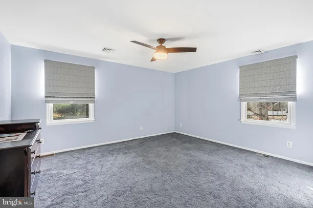 a storage room with furniture and a book shelf