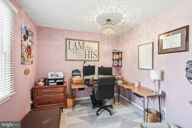 a view of a workspace with furniture