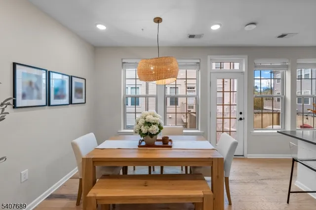 a living room with furniture a window and a flat screen tv