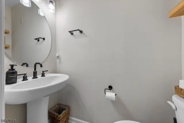 a bathroom with a toilet and a sink