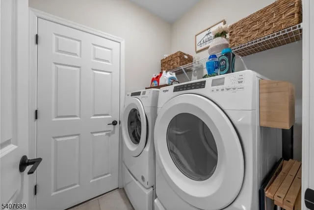 a bedroom with a bed and large windows