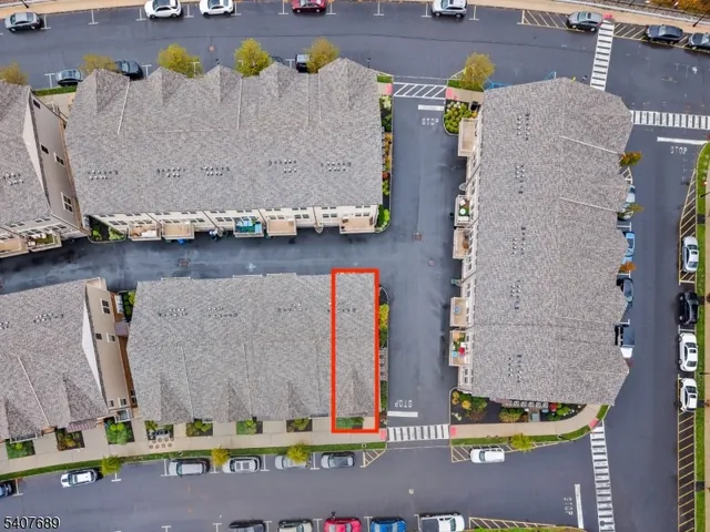 an aerial view of a city with lawn chairs