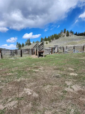 a view of a big yard with a building in the background
