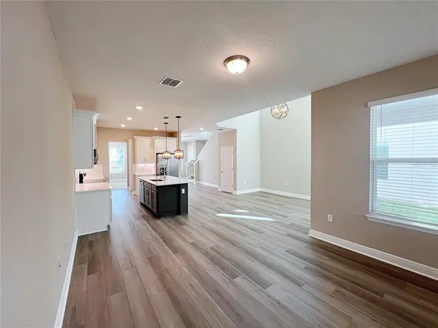 a view of a kitchen with a sink and a window