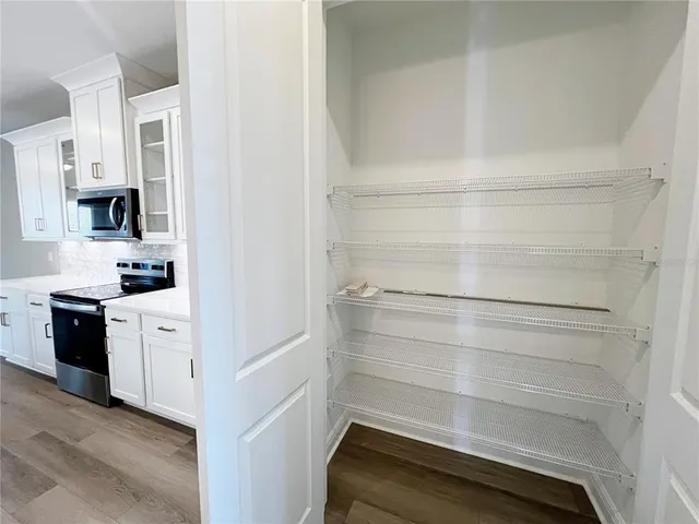 a walk in closet with a vanity