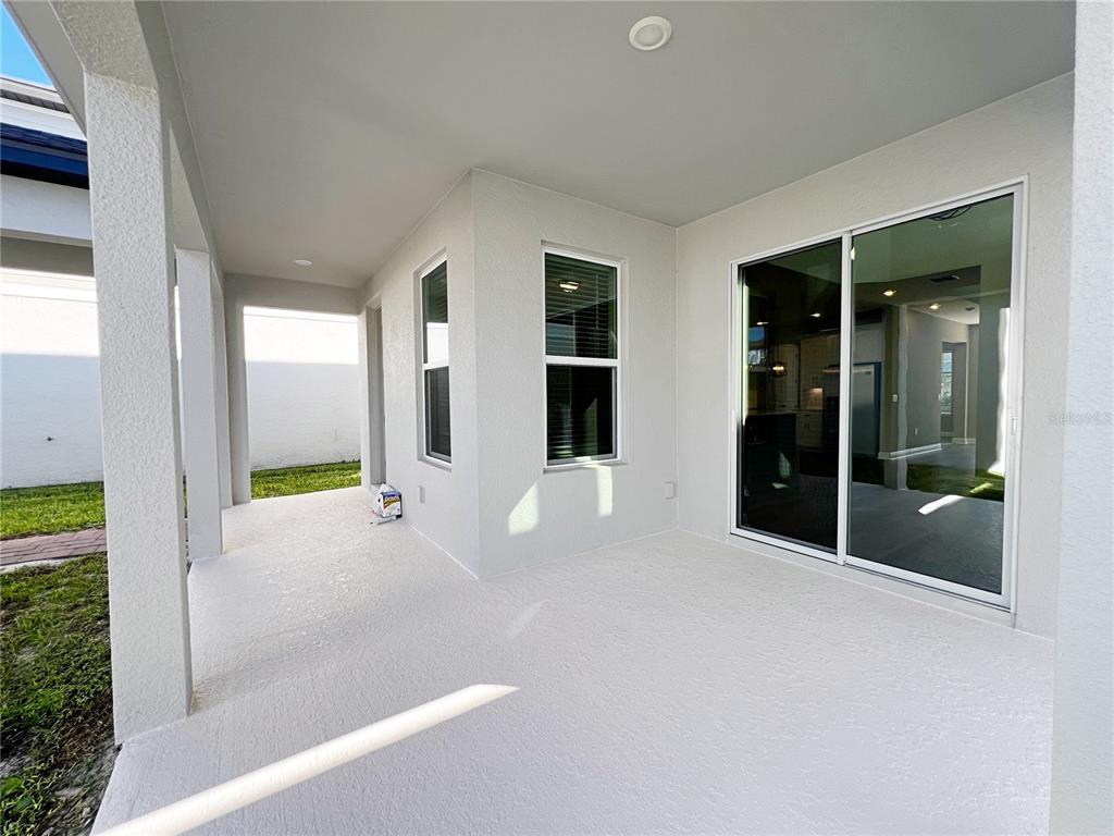 14111 Frasier Street Winter Garden, FL 34787 - Photo 19 of 41 a view of an empty room with glass door and balcony