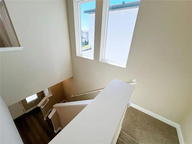 a view of chair and table in a room