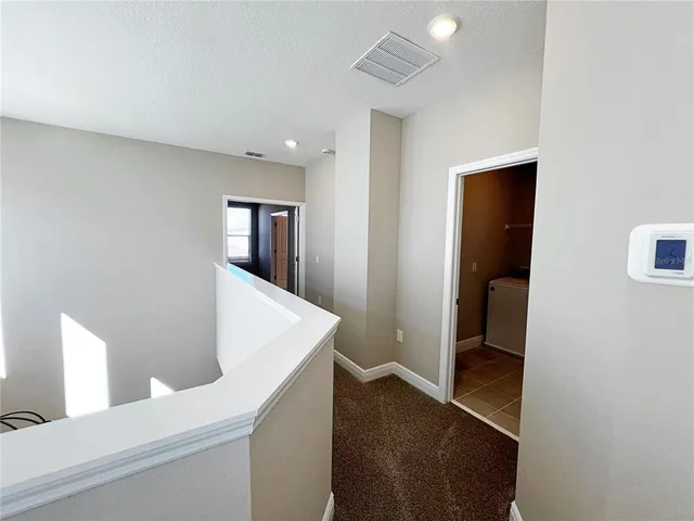 a view of a hallway with an empty room