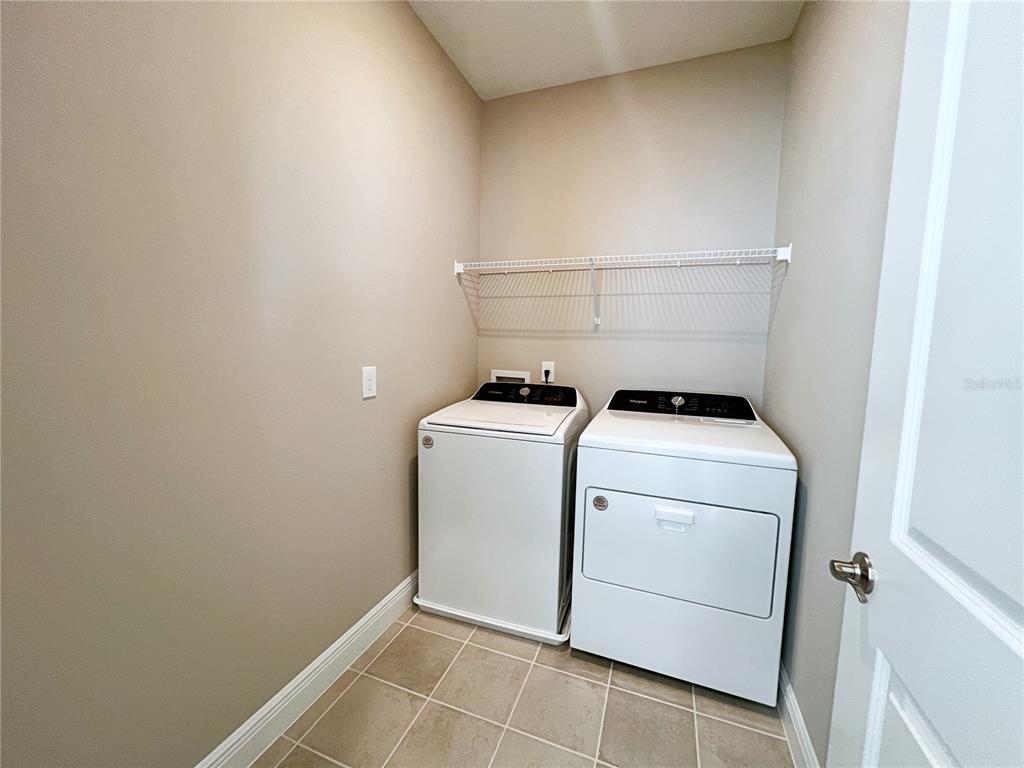 14111 Frasier Street Winter Garden, FL 34787 - Photo 24 of 41 a utility room with dryer and washer
