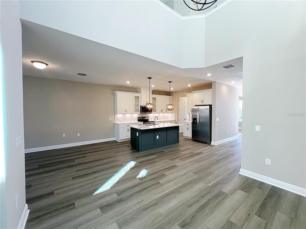 14111 Frasier Street Winter Garden, FL 34787 - Photo 8 of 41 a view of kitchen cabinets and wooden floor
