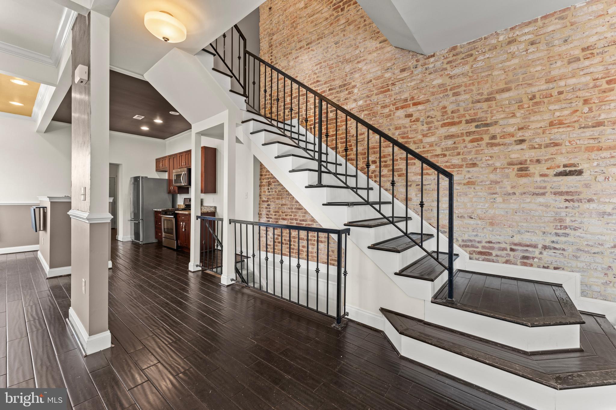 3616 Reisterstown Road Baltimore, MD 21215 - Photo 12 of 34 a view of entryway and hall with wooden floor