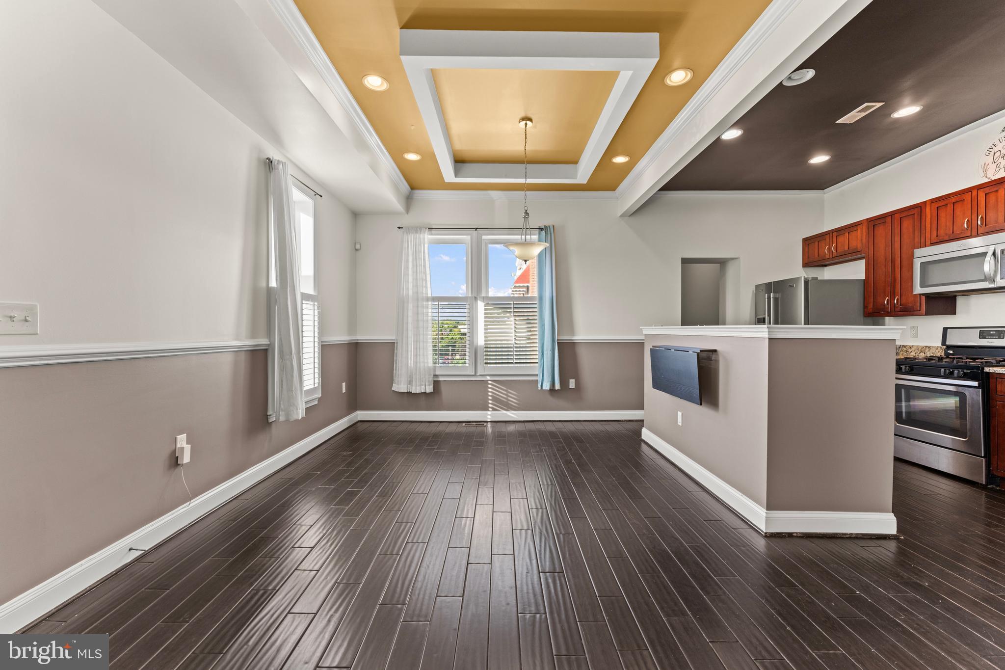 3616 Reisterstown Road Baltimore, MD 21215 - Photo 2 of 34 a view of a livingroom with furniture wooden floor and window