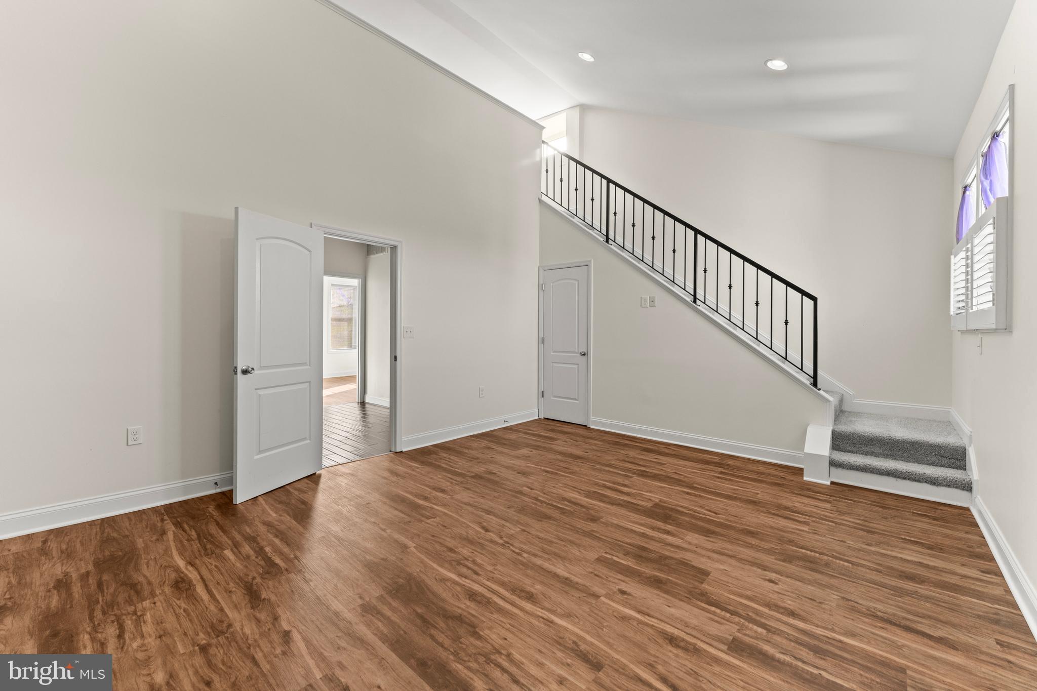 3616 Reisterstown Road Baltimore, MD 21215 - Photo 24 of 34 a view of an empty room with wooden floor