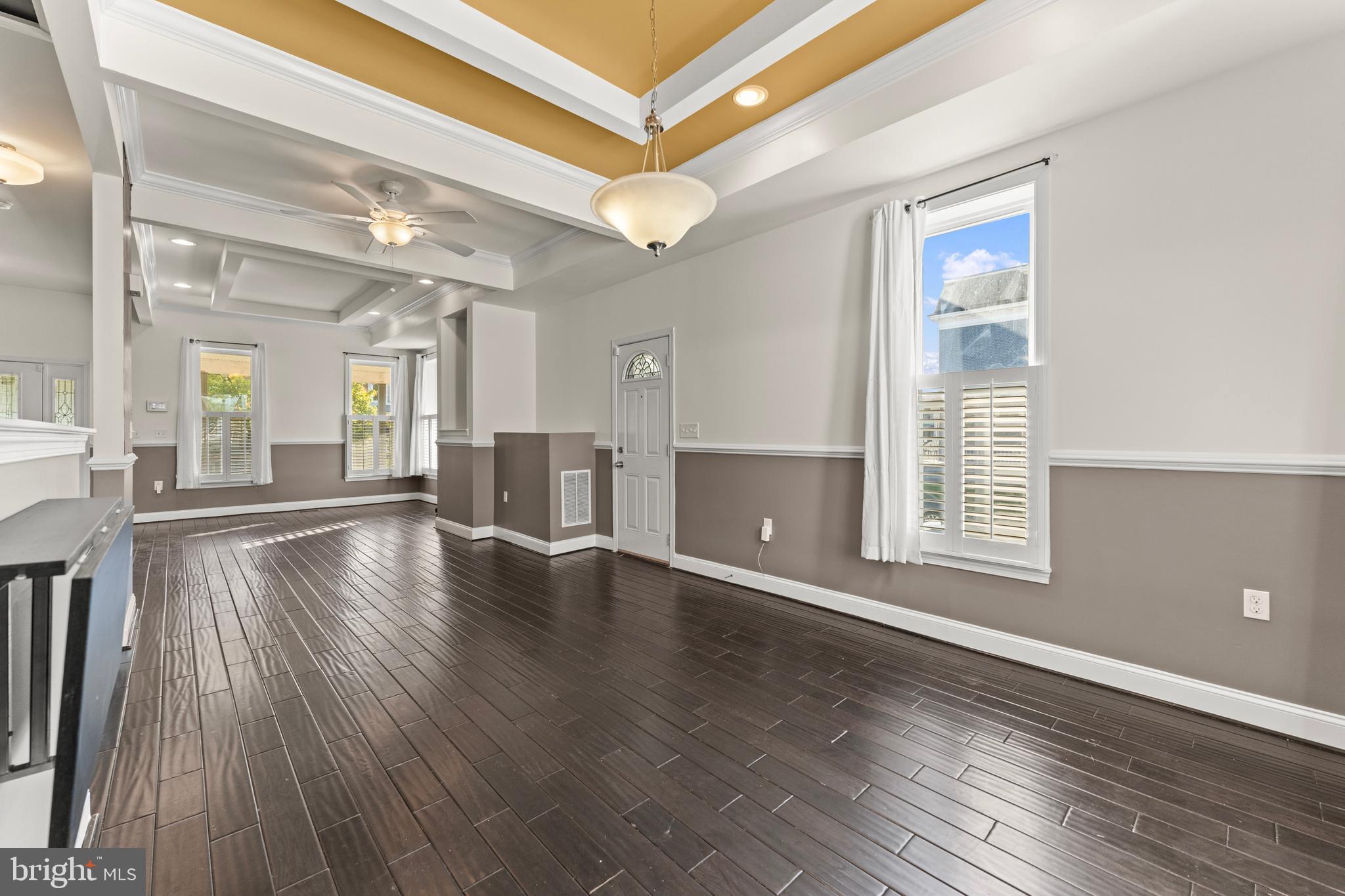 3616 Reisterstown Road Baltimore, MD 21215 - Photo 9 of 34 a view of an empty room with wooden floor and a window