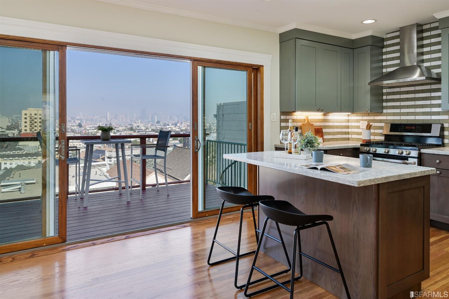 41 Montezuma Street San Francisco, CA 94110 - Photo 14 of 62 a kitchen with a table chairs and a kitchen view