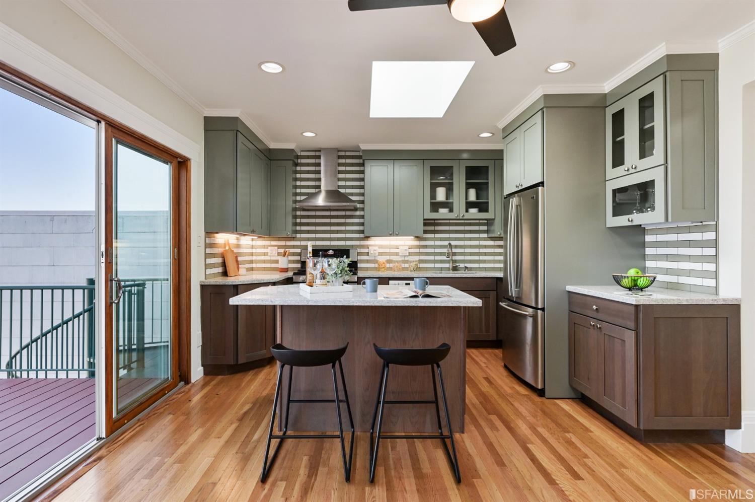 41 Montezuma Street San Francisco, CA 94110 - Photo 15 of 62 a kitchen with stainless steel appliances granite countertop a sink and wooden cabinets