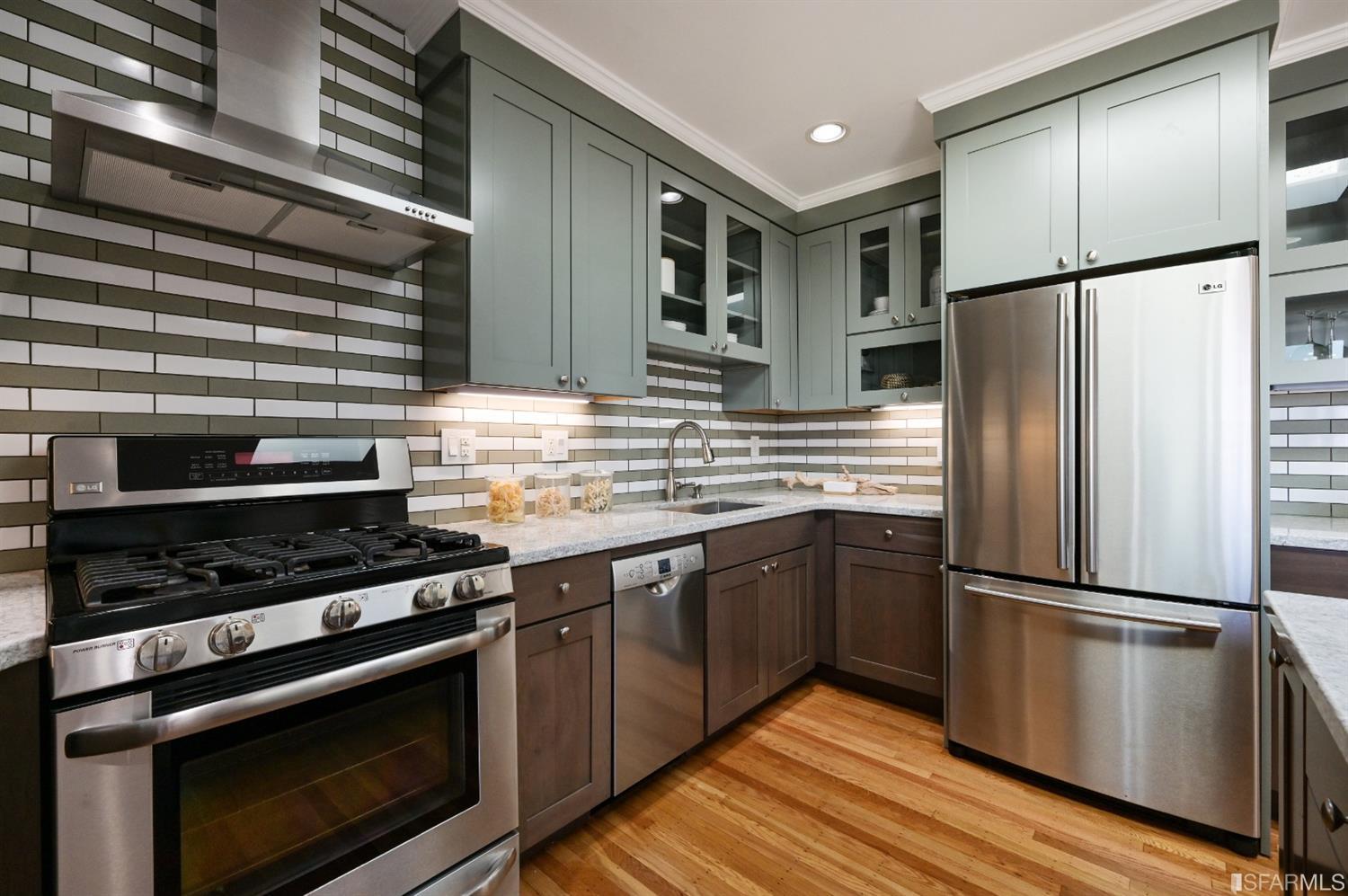 41 Montezuma Street San Francisco, CA 94110 - Photo 19 of 62 a kitchen with granite countertop stainless steel appliances and wooden cabinets