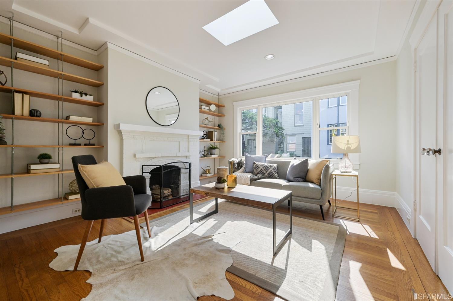 41 Montezuma Street San Francisco, CA 94110 - Photo 3 of 62 a living room with furniture a fireplace and a floor to ceiling window