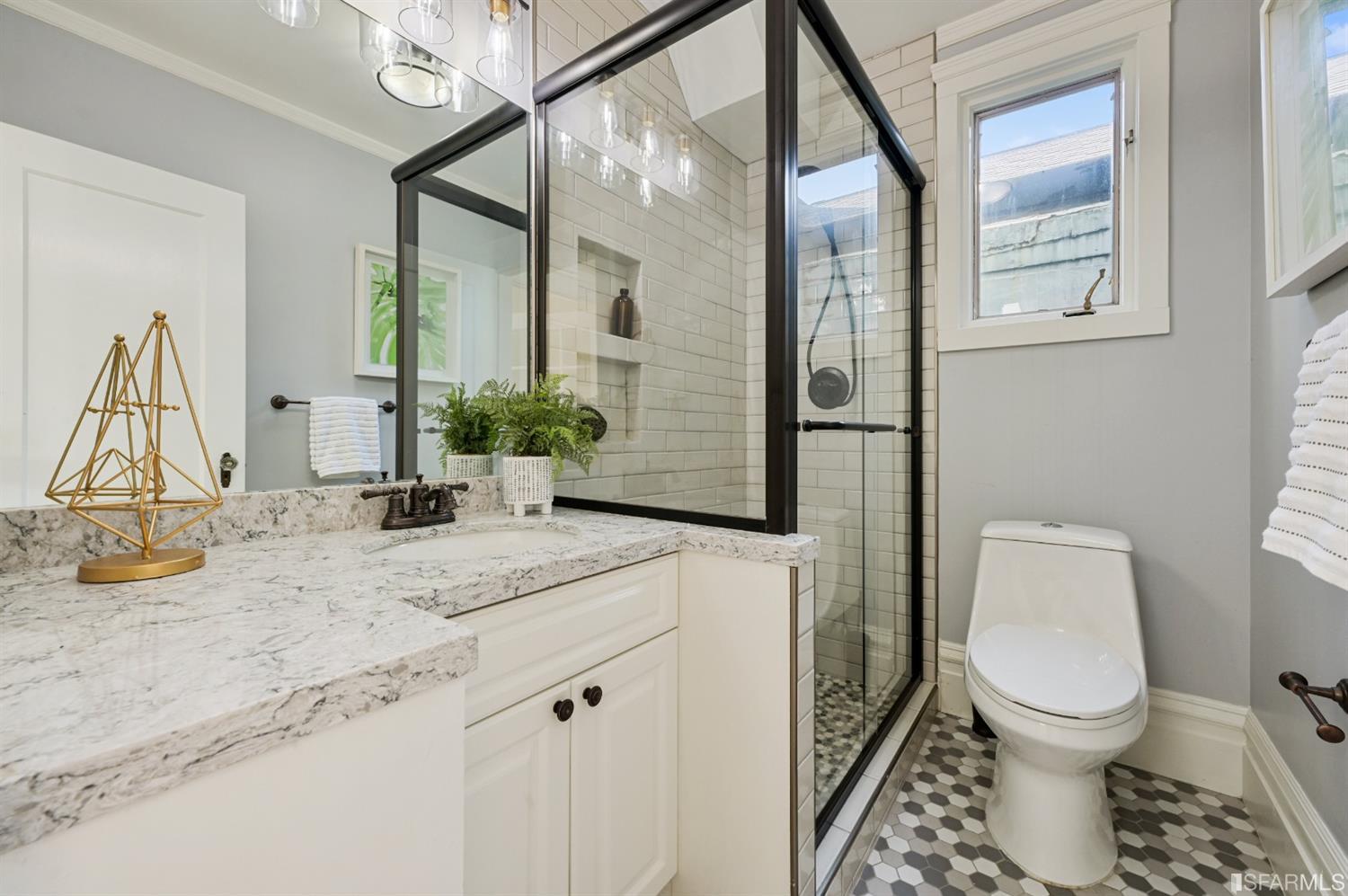 41 Montezuma Street San Francisco, CA 94110 - Photo 32 of 62 a bathroom with a granite countertop sink a toilet and a mirror