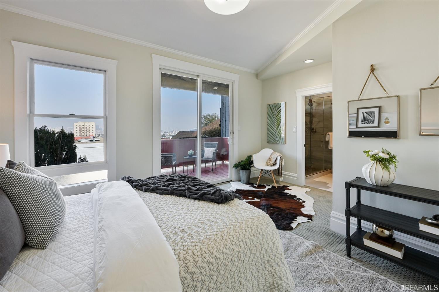 41 Montezuma Street San Francisco, CA 94110 - Photo 37 of 62 a bedroom with a bed large window mirror and couch