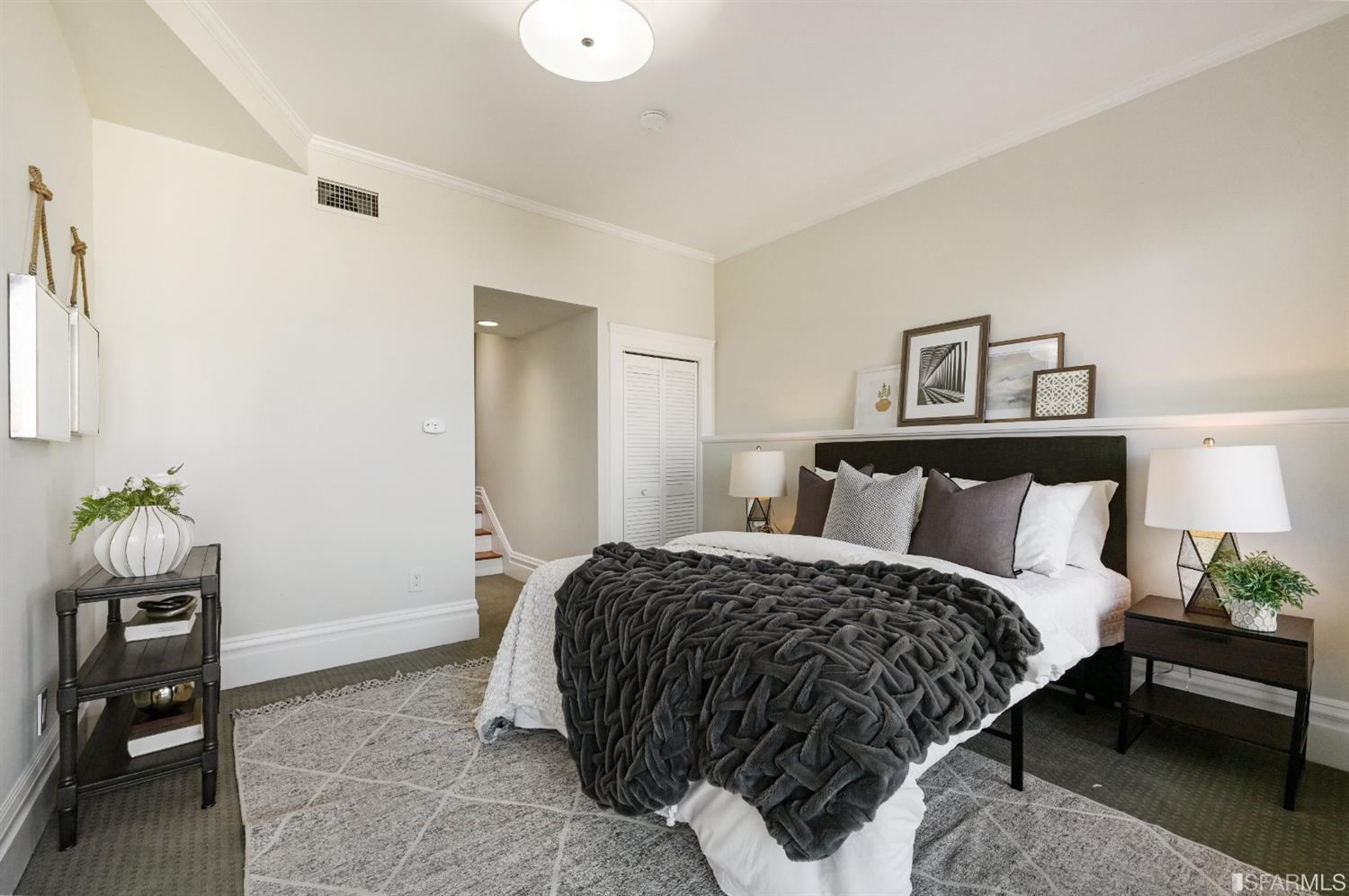 41 Montezuma Street San Francisco, CA 94110 - Photo 39 of 62 a bedroom with a bed and painting on the wall