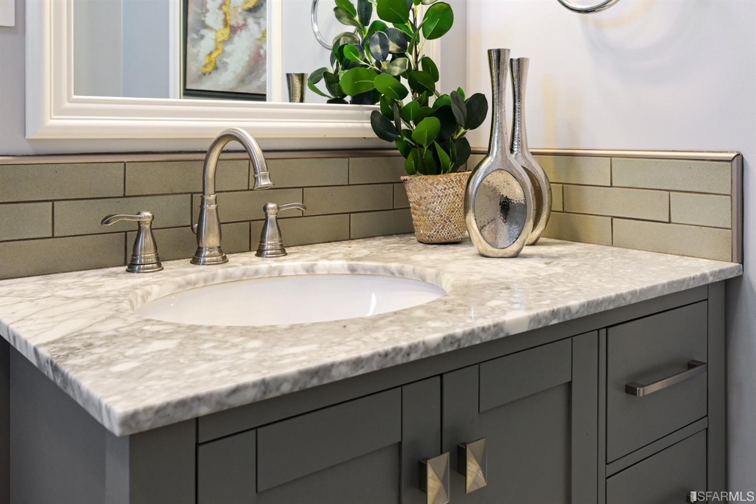 41 Montezuma Street San Francisco, CA 94110 - Photo 43 of 62 a bathroom with a granite countertop sink a potted plant and a window