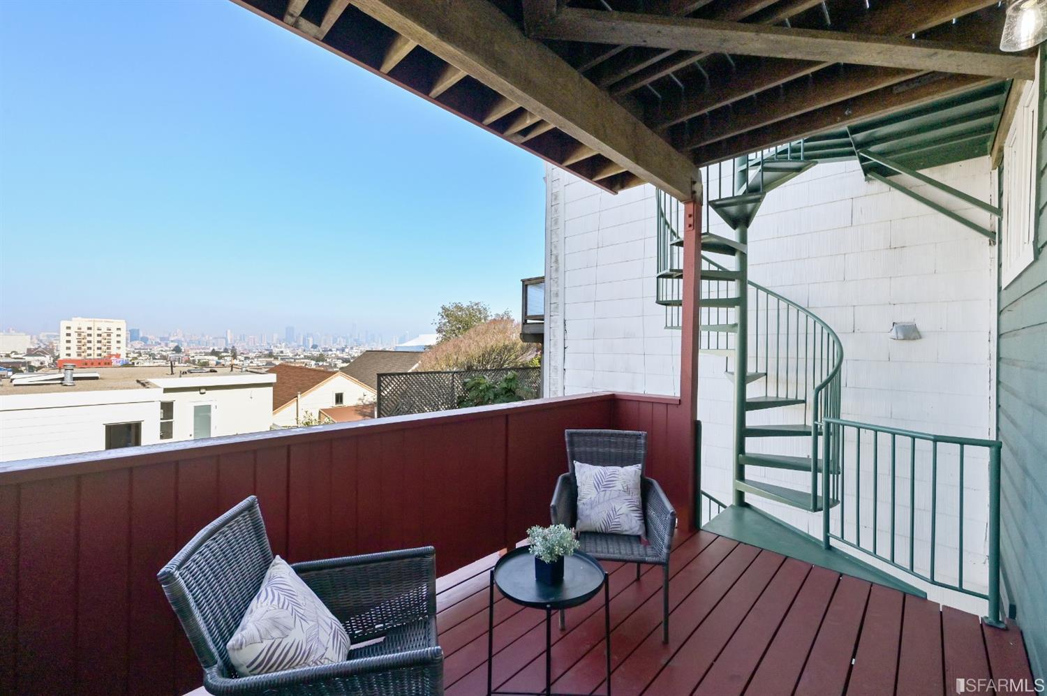 41 Montezuma Street San Francisco, CA 94110 - Photo 46 of 62 a view of balcony with furniture and wooden floor