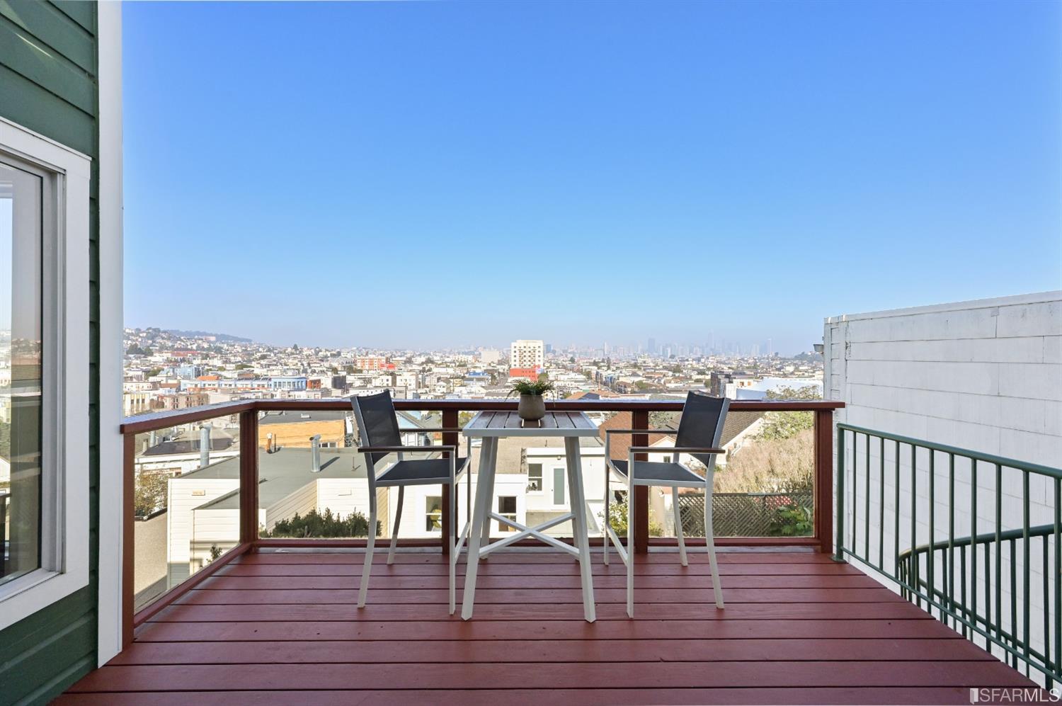 41 Montezuma Street San Francisco, CA 94110 - Photo 48 of 62 a view of a balcony with wooden floor