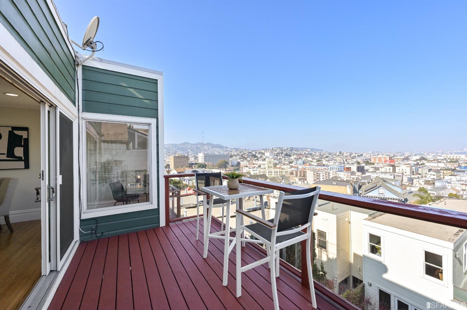 41 Montezuma Street San Francisco, CA 94110 - Photo 49 of 62 a view of a balcony with chair and wooden floor