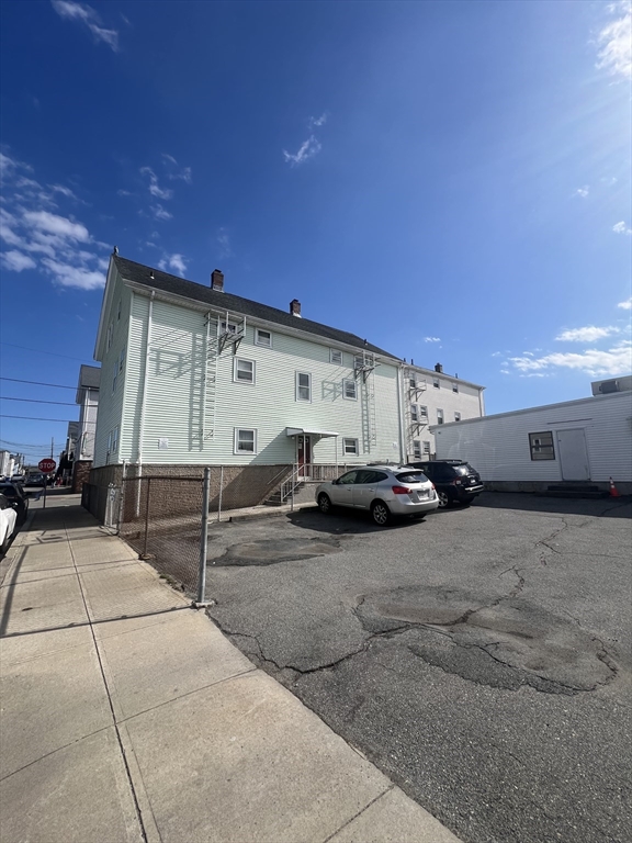 305 4th Street Fall River, MA 02721 - Photo 5 of 8 a view of a terrace with a flat screen tv