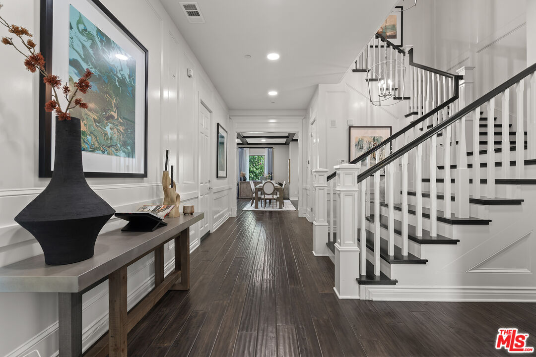 55 Suede Irvine, CA 92602 - Photo 2 of 59 a view of entryway and hall with wooden floor