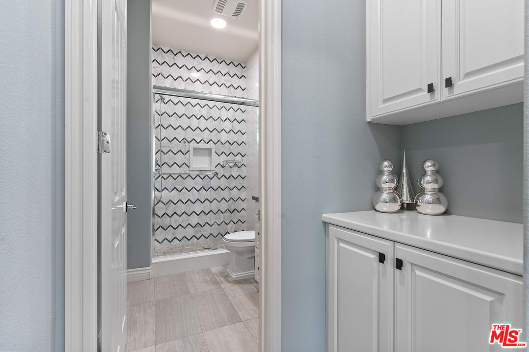 55 Suede Irvine, CA 92602 - Photo 21 of 59 a bathroom with a shower