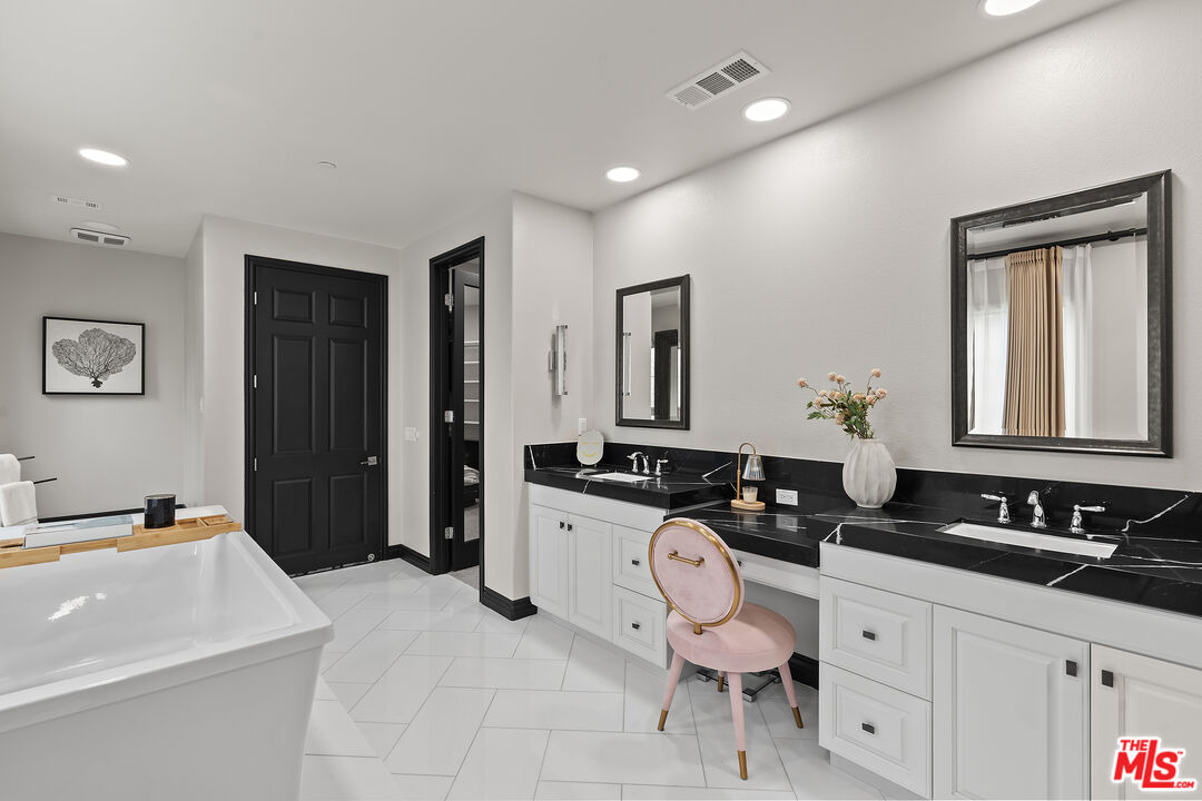 55 Suede Irvine, CA 92602 - Photo 37 of 59 a bathroom with a sink and a mirror