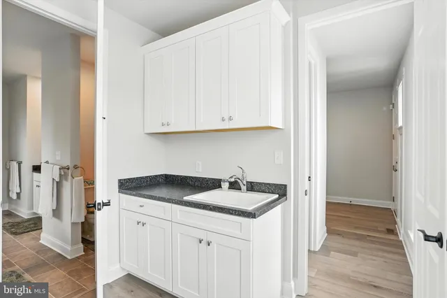 a kitchen with a sink and cabinets