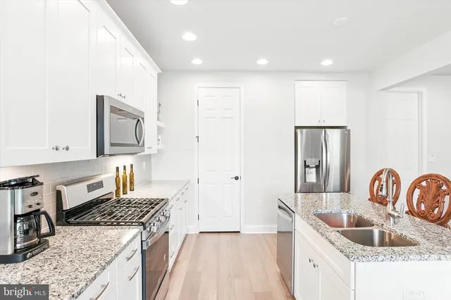 a kitchen with a stove and a sink