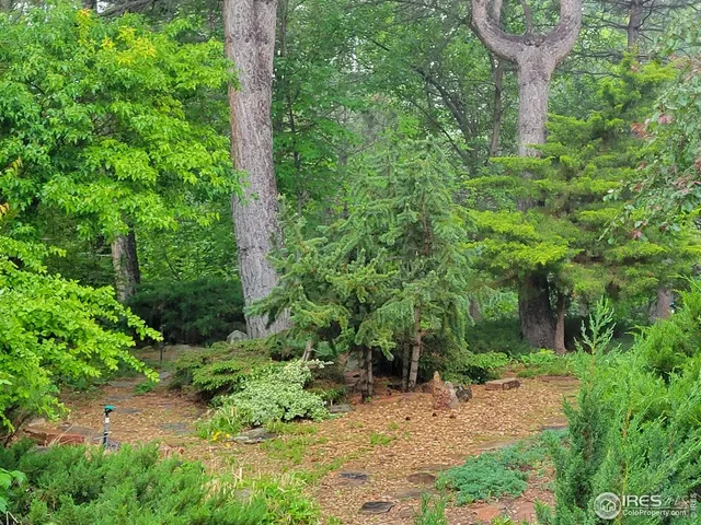 an aerial view of house with yard swimming pool and outdoor seating